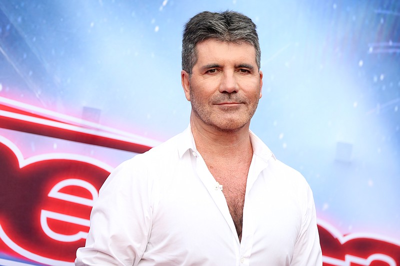 
              FILE - In this March 3, 2016 file photo, Simon Cowell arrives at the "America's Got Talent" Season 11 Red Carpet Kickoff in Pasadena, Calif. Cowell will be back in front of the cameras for "America's Got Talent" next season. Cowell, who created the show's format in Britain, is returning for his second turn as a judge, NBC said Tuesday, Aug. 2. (Photo by Rich Fury/Invision/AP, File)
            
