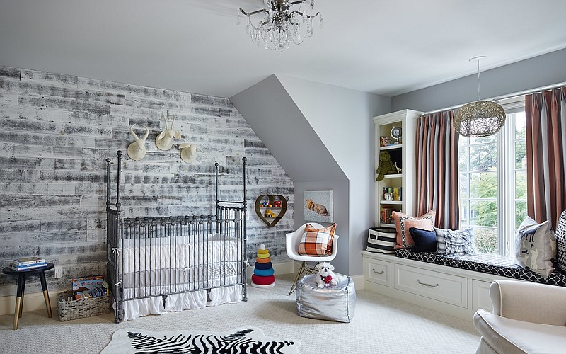 This baby room has a wood wall designed by Carrie Rodman. Wood walls are a strong décor trend, and they're a far cry from the dowdy paneling of decades past.(Corey Gaffer/Martha O'Hara Interiors/Stikwood via AP)