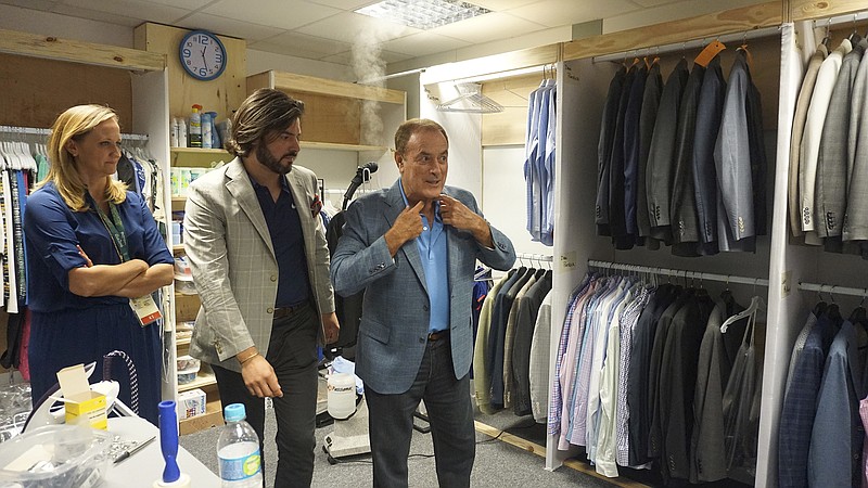 NBC broadcaster Al Michaels, far right, is fitted in a Hardwick blazer in preparation for the Rio Olympics. Jake Cremer, director of brand and digital strategy at Hardwick, is in Rio the length of the games representing the Cleveland, Tenn., company.