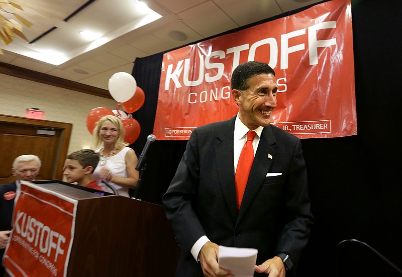 
              David Kustoff takes the stage with his family to thank his supporters as they celebrate his win for District 8 House of Representatives in Memphis, Tenn., Thursday, Aug. 4, 2016. (Nikki Boertman/The Commercial Appeal via AP)
            