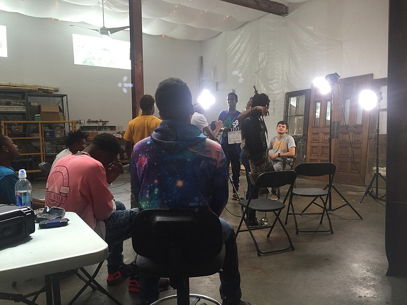 Professional filmmaker Sam Doughty is being interviewed by the members of the Magic Markers program crew. The 10 teens in the program wrote and recorded a rap called "Stop the Violence"and, in addition, interviewed community members on camera about what Chattanooga and music means to them.