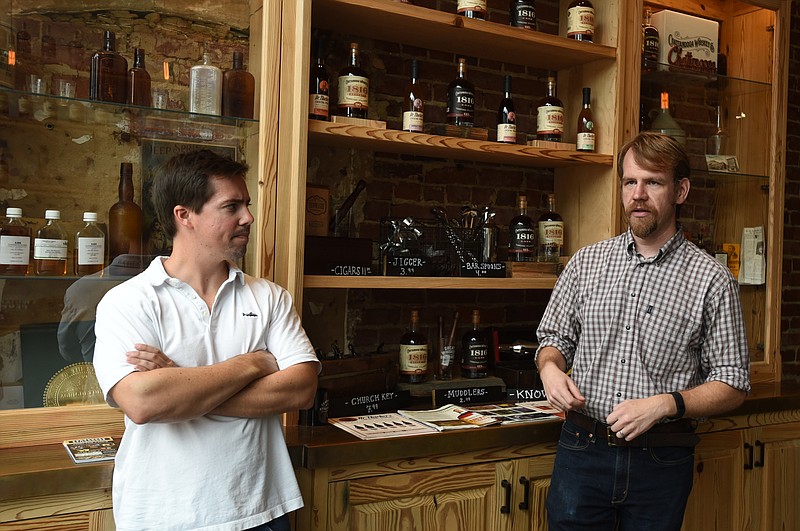 Matt Rogers and Tim Piersant, CEO and co-founder of Chattanooga Whiskey Stillhouse, talk Aug. 17, 2015, at Chattanooga Whiskey Stillhouse.