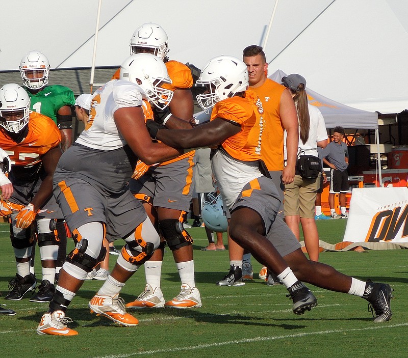 Right tackle Chance Hall battles defensive end Darrell Taylor in a pass-blocking drill during Tennessee's practice at Haslam Field on Aug. 4, 2016.