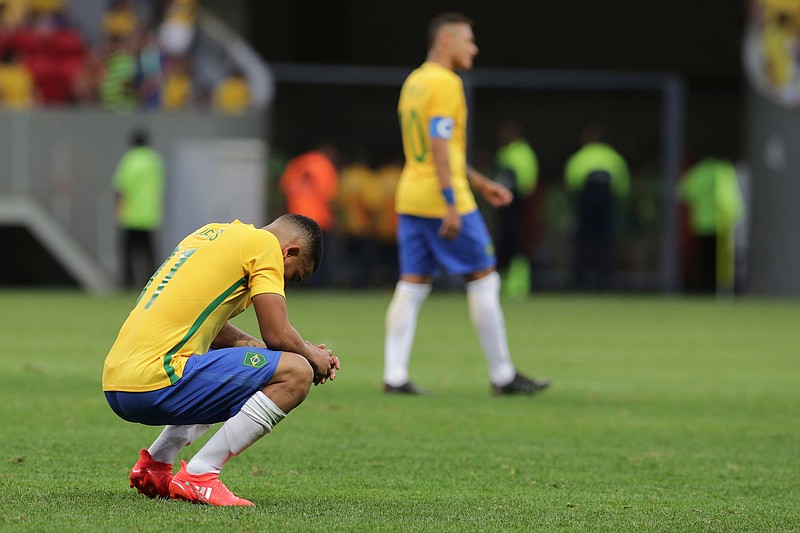 
              Brazil's Gabriel Jesus, left, reacts at the end a group A match of the men's Olympic football tournament between Brazil and South Africa at the National stadium, in Brasilia, Brazil, Thursday, Aug. 4, 2016. The game ended in a 0-0 draw. (AP Photo/Eraldo Peres)
            