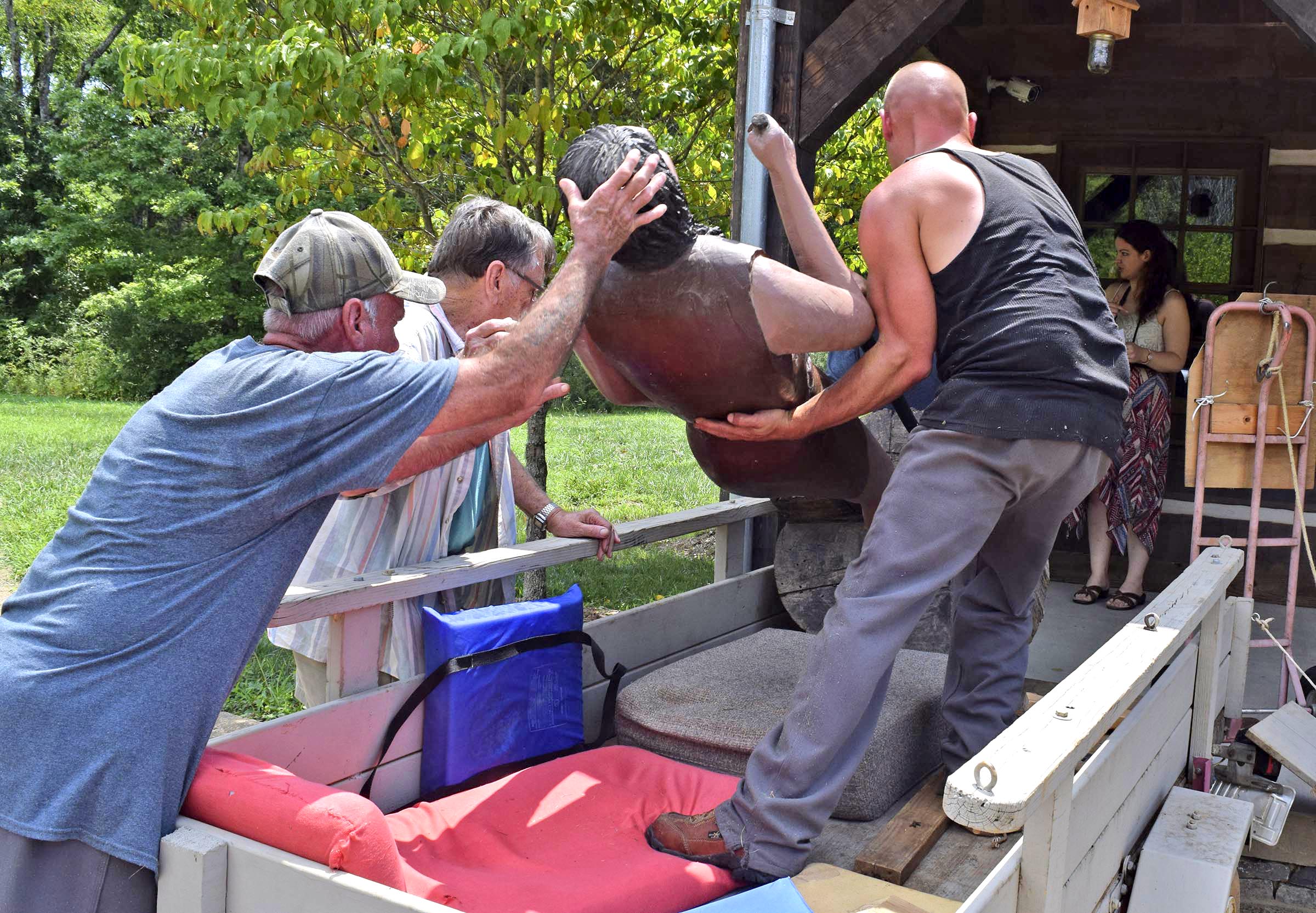 A team of Meigs County inmates unload a sculpture of early-1800s Cherokee interpreter John Spears carved by former resident Ray Hoskins that was donated this week to the Cherokee Removal Memorial Park. He and his wife, Shirley. Shirley Hoskins is the great-great-great-great granddaughter of Spears.