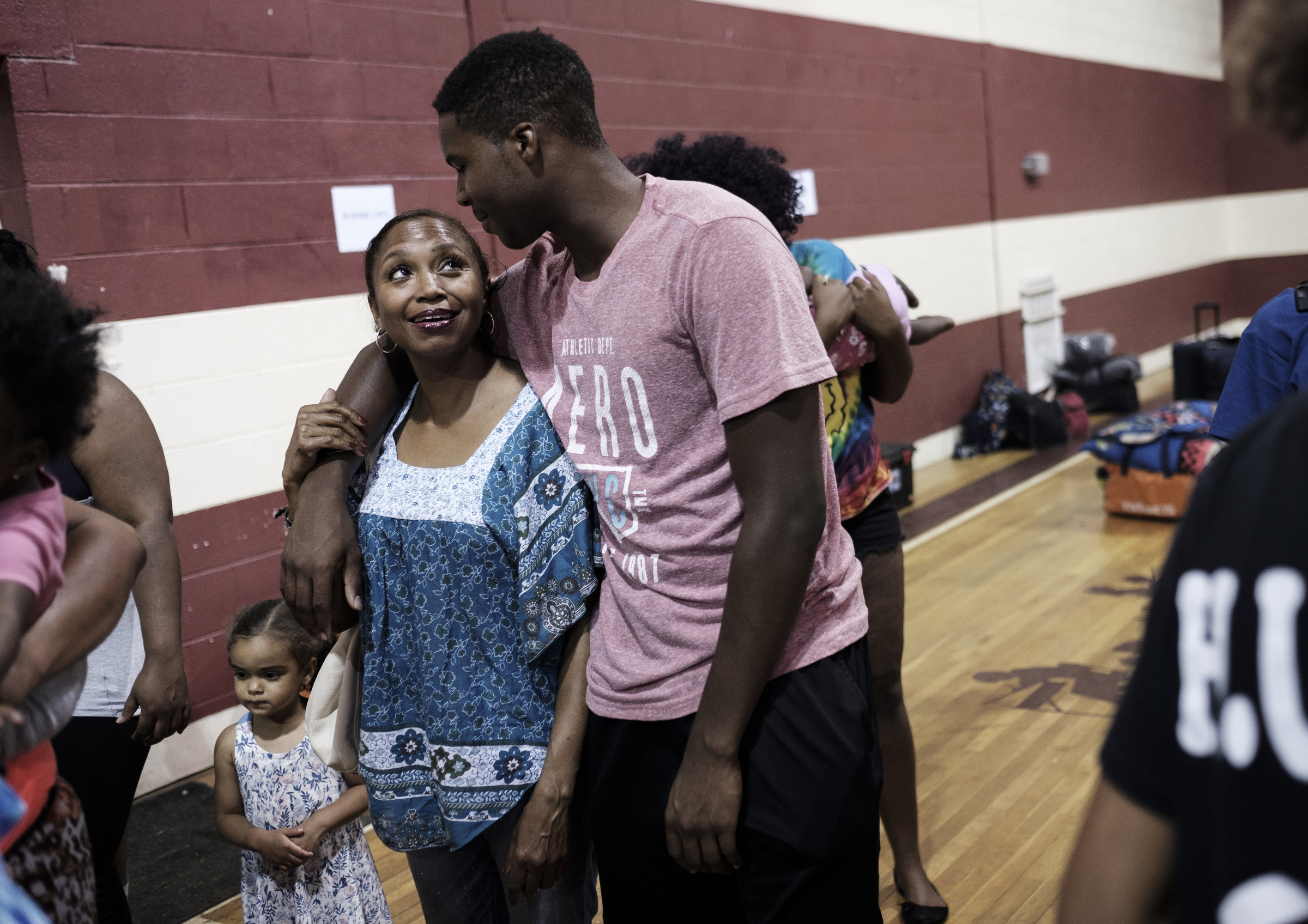 Cam Chambers talks with his aunt, Antoinette Green, before saying goodbye to leave for the Kids Across America camp from Hope for the Inner City on Saturday, July 23, 2016, in Chattanooga, Tenn. Green is Chambers' guardian, and a Chattanooga Police Officer, Danny Jones, acts as a father figure for Cam.