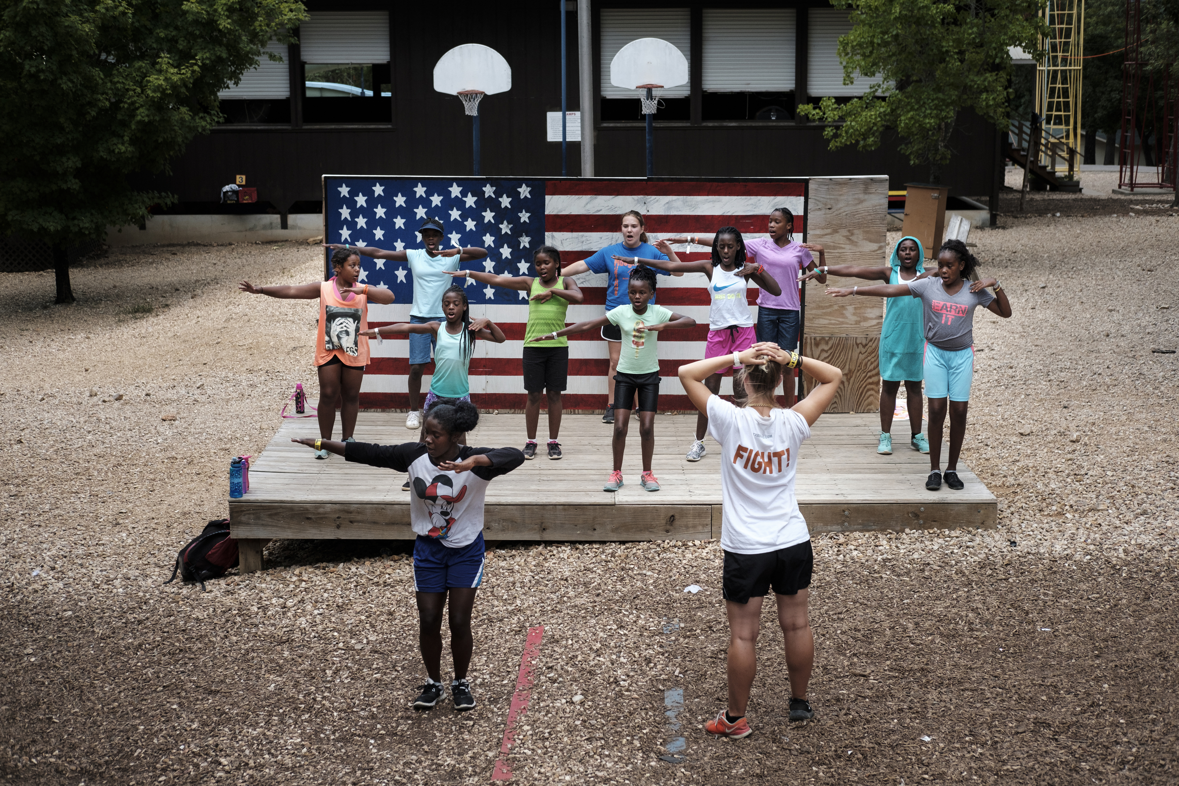 Kids participate in a cheer group in the K2 camp, which is the middle age group camp, at the Kids Across America camp Tuesday, July 26, 2016, near Branson, Mo. The camp ministers to inner-city youths brought from across the country.
