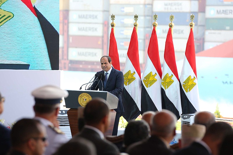 
              In this photo provided by Egypt's state news agency MENA, Egyptian President Abdel-Fattah el-Sissi, gives a speech marking the first anniversary the first anniversary of the inauguration of an expansion of the Suez Canal, in Suez, Egypt, Saturday, Aug. 6, 2016. Egypt's president has defiantly dismissed criticism of his handling of the country's ailing economy, arguing that the skeptics were seeking to undermine the will of Egyptians. (MENA via AP)
            