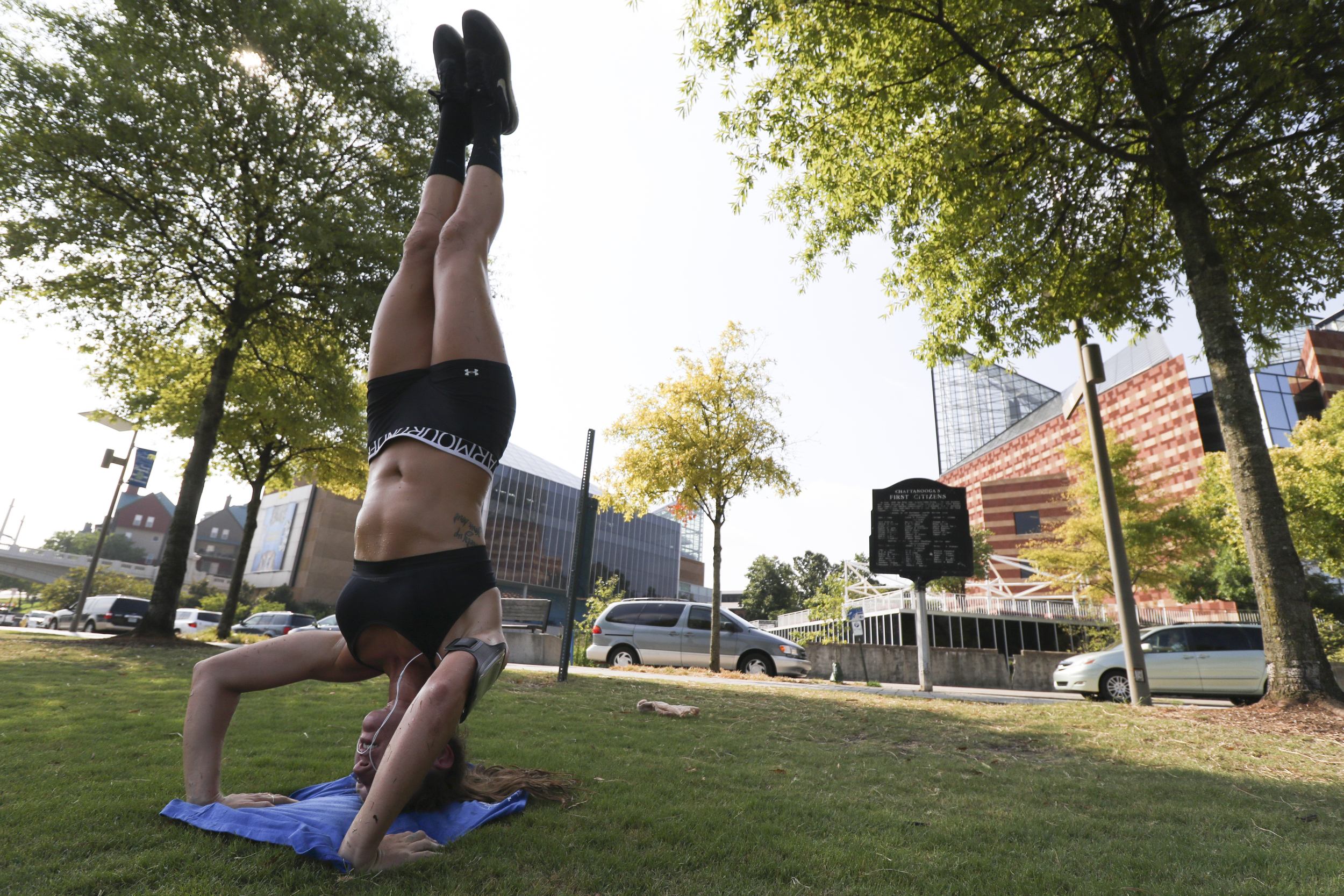 Staff Photo by Dan Henry / The Chattanooga Times Free Press- 8/5/16. Jesse Nathanson, a beach volleyball player from Wilmington, North Carolina, performs her daily workout along the waterfront while visiting the Scenic City on Friday, August 5, 2016.