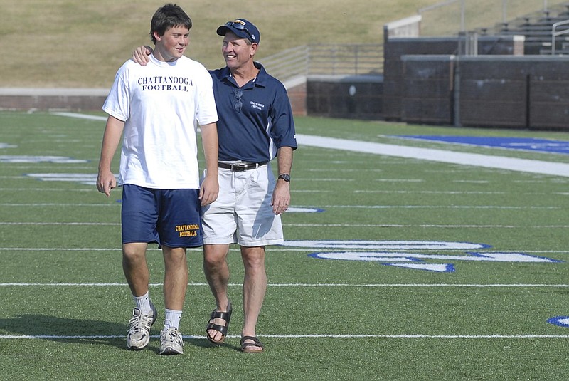 Rodney Allison, left, UTC's head football coach at the time, walks alongside his son Sloan at Finley Stadium in 2008. Coach Allison was mentioned by Pro Football Hall of Famer Brett Favre during his induction speech Saturday night in Canton, Ohio. Allison was offensive coordinator and quarterbacks coach at Southern Mississippi when Favre played there before going on to a long and successful NFL career.