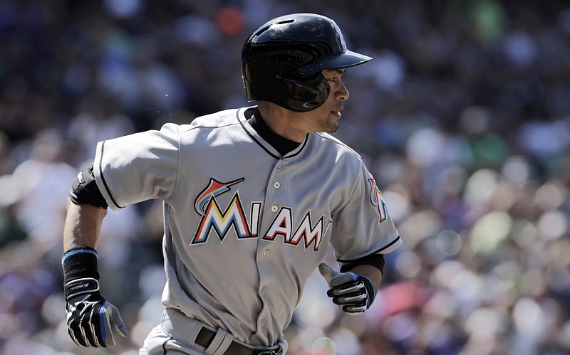 
              Miami Marlins' Ichiro Suzuki (51) runs to first base on a ground out in the third inning of a baseball game against the Colorado Rockies in Denver on Sunday, Aug. 7, 2016. Suzuki is one hit away from 3,000 in his Major League Baseball career. (AP Photo/Joe Mahoney)
            