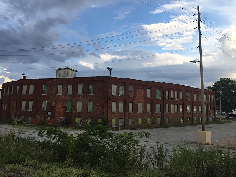 A 54,000-square-foot brick warehouse along the railroad tracks at the end of Rossville Boulevard on Chattanooga's Southside is part of a proposed new development. Developers want to renovate the three-story building and adjacent six acres for apartments, condominiums, offices, stores and a restaurant. 