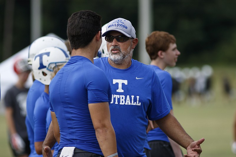 Trion football coach Justin Brown talks to players at a 7-on-7 passing camp on Wednesday, July 13, 2016, in Calhoun, Tenn.