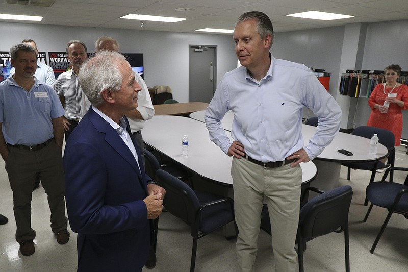 Polartec President Gary Smith, right talks with U.S. Sen. Bob Corker. R-Tenn., at the company's new plant in Cleveland, Tennessee.