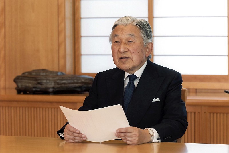 
              In this photo taken Sunday, Aug. 7, 2016 and provided by the Imperial Household Agency of Japan on Monday, Aug. 8, 2016, Japan's Emperor Akihito reads a message for recording at the Imperial Palace in Tokyo. Akihito expressed concern about fulfilling his duties as he ages in an address to the public in a 10-minute recorded speech broadcast on national television Monday that was remarkable for its rarity and its hinted possibility that he may want to abdicate in a few years. (Imperial Household Agency of Japan via AP)
            