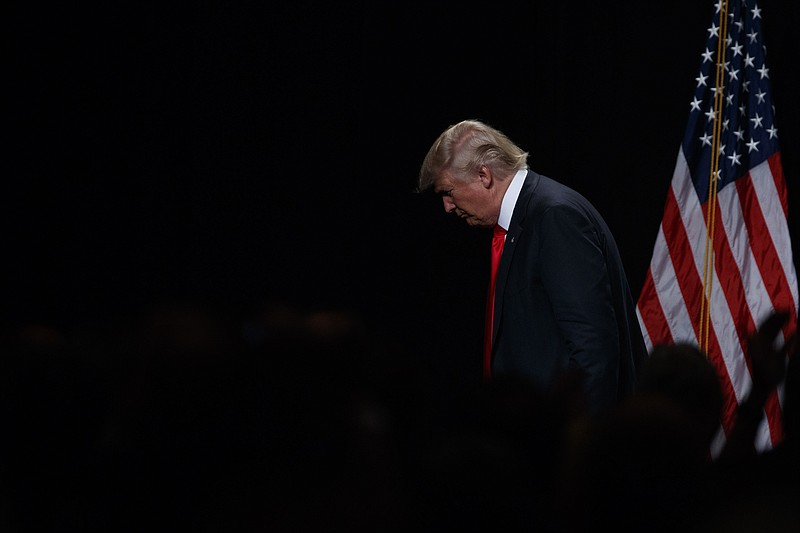 
              Republican presidential candidate Donald Trump leaves after giving an economic policy speech to the Detroit Economic Club, Monday, Aug. 8, 2016, in Detroit. (AP Photo/Evan Vucci)
            