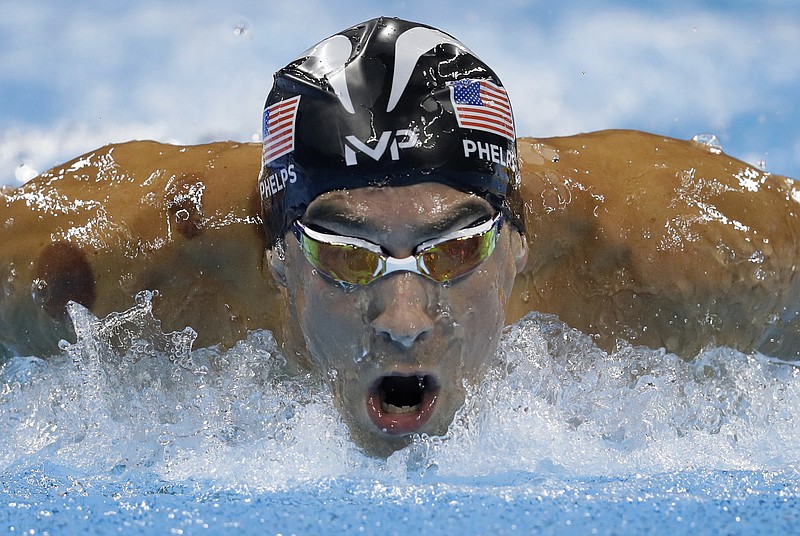 
              United States' Michael Phelps competes in a men's 200-meter butterfly semifinal during the swimming competitions at the 2016 Summer Olympics, Monday, Aug. 8, 2016, in Rio de Janeiro, Brazil. (AP Photo/Michael Sohn)
            