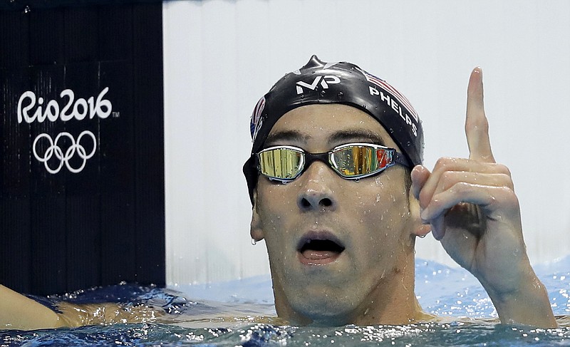 United States' Michael Phelps celebrates after winning the gold medal in the men's 200-meter butterfly final during the swimming competitions at the 2016 Summer Olympics, Tuesday, Aug. 9, 2016, in Rio de Janeiro, Brazil.