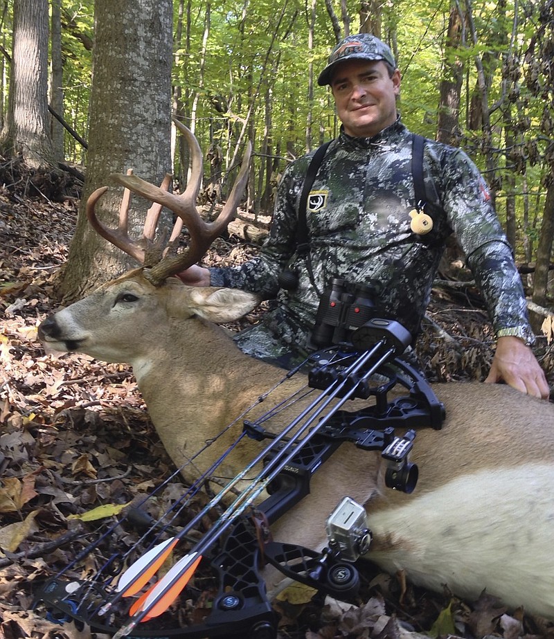 David Healy poses with a nice buck taken using Wind Pro attractant. Wind Pro's powder form synthetic lure is designed to be placed in mock buck scrapes well in advance of hunting season, writes outdoors columnist Larry Case.