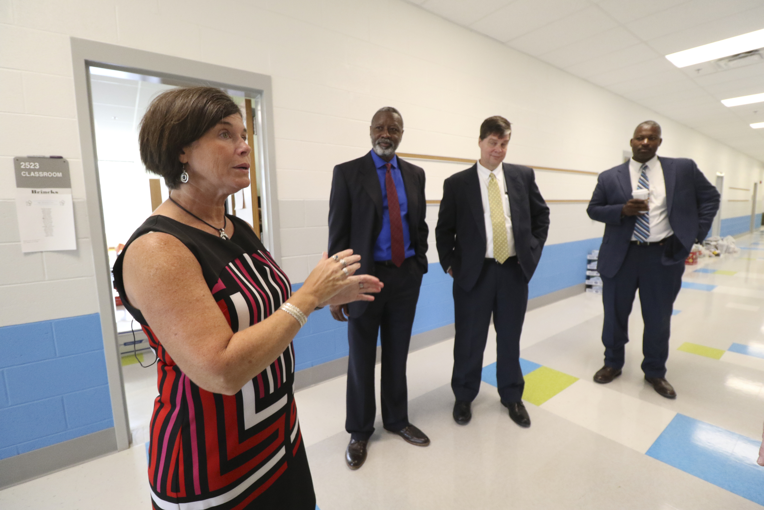 Staff Photo by Dan Henry / The Chattanooga Times Free Press- 8/9/16. Allyson DeYoung, principal of the new Middle Valley Elementary School, leads Kirk Kelly, Lee McDade and Zac Brown on a tour of the new school on Tuesday, August 9, 2016.