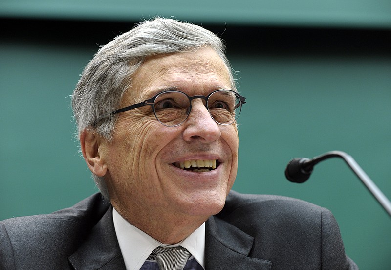 Federal Communications Commission (FCC) Chairman Tom Wheeler testifies on Capitol Hill in Washington, Thursday, Dec. 12, 2013, before the House Energy and Commerce Committee hearing on cell phones on planes. As one part of the federal government looks to remove restrictions on making phone calls from airplanes, another agency is apparently considering its own prohibition. Wheeler told members of Congress that while his agency sees no technical reason to ban calls on planes, Transportation Secretary Anthony Foxx told him Thursday morning that the DOT will be moving forward with its own restrictions.  (AP Photo/Susan Walsh)