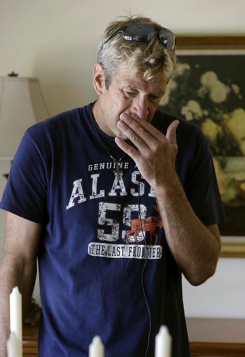 
              Steve Knowlton wipes his face as he talks about his mother Mary Knowlton during an interview Wednesday, Aug. 10, 2016, in Punta Gorda, Fla. Police say an officer accidentally shot Mary to death during a citizen's academy "shoot/don't shoot" exercise Tuesday evening. (AP Photo/Chris O'Meara)
            