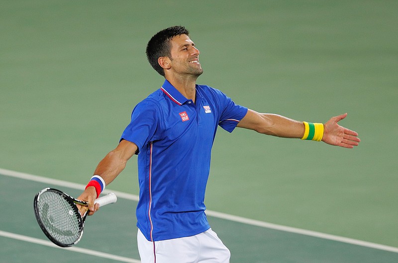 
              Novak Djokovic, of Serbia, gestures after winning a point against Juan Martin del Potro, of Argentina, in the men's tennis competition at the 2016 Summer Olympics in Rio de Janeiro, Brazil, Sunday, Aug. 7, 2016. (AP Photo/Vadim Ghirda)
            