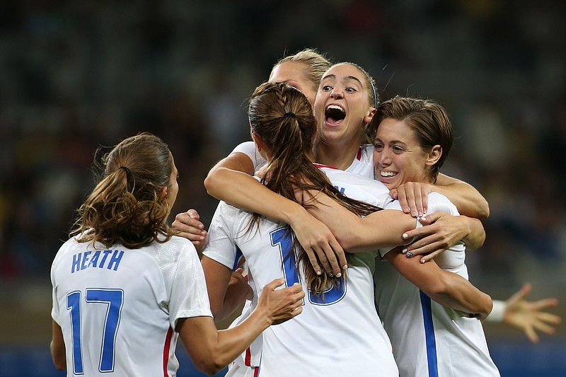 United States' Morgan Brian, second right, celebrates with her teammates after Alex Morgan score her side's 2nd goal against New Zealand during a women's Olympic football tournament match at the Mineirao stadium in Belo Horizonte, Brazil, Wednesday, Aug. 3, 2016. United States won 2-0. (AP Photo/Eugenio Savio)