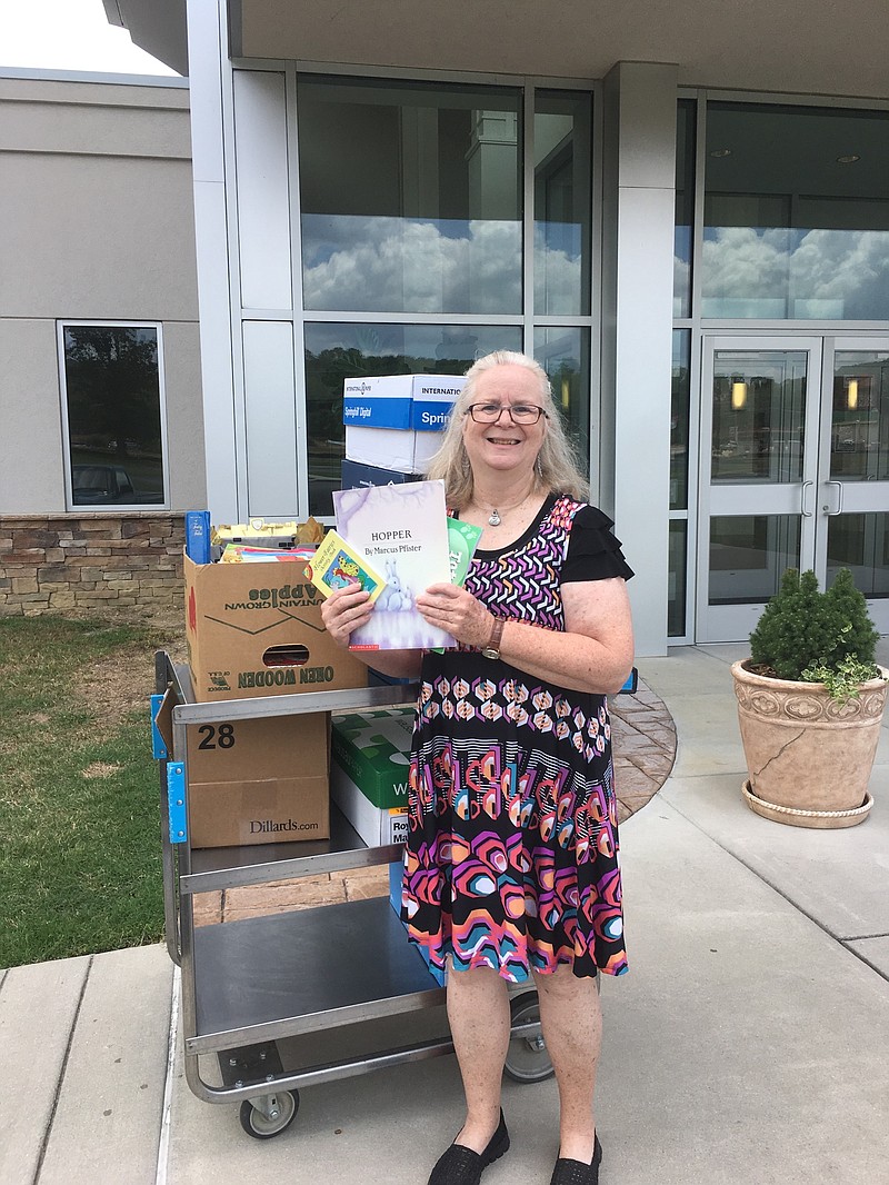 Becky Hall, the director of ministries at East Brainerd's Christ United Methodist Church, delivers hundreds of books donated by members of her church to Erlanger's Dodson Avenue Community Health Center.
