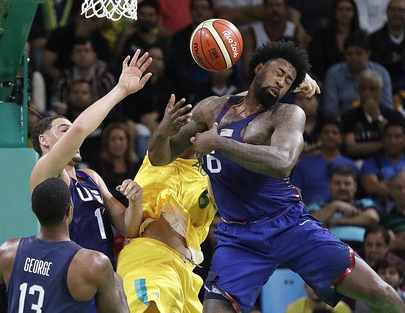 
              Australia's Andrew Bogut, center, United States' DeAndre Jordan (6) and United States' Klay Thompson (11) scramble for a rebound during a men's basketball game at the 2016 Summer Olympics in Rio de Janeiro, Brazil, Wednesday, Aug. 10, 2016. (AP Photo/Eric Gay)
            