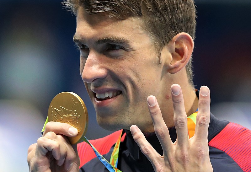 United States' Michael Phelps celebrates winning the gold medal in the men's 200-meter individual medley during the swimming competitions at the 2016 Summer Olympics, Thursday, Aug. 11, 2016, in Rio de Janeiro, Brazil. 