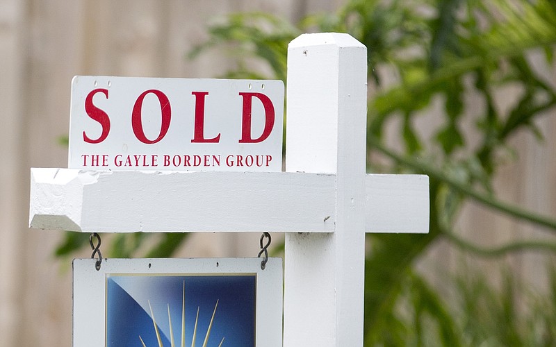 
              FILE - In this July 22, 2015, file photo, a "Sold" sign is posted outside a Harbor Beach neighborhood home in Fort Lauderdale, Fla. Losing a home to a foreclosure or short sale is devastating, but it doesn’t have to define you. Rebuilding credit, working with a housing counselor and steering clear of predatory lenders are just a few of the ways to get back on your feet and on the path to owning another home. (AP Photo/Wilfredo Lee, File)
            