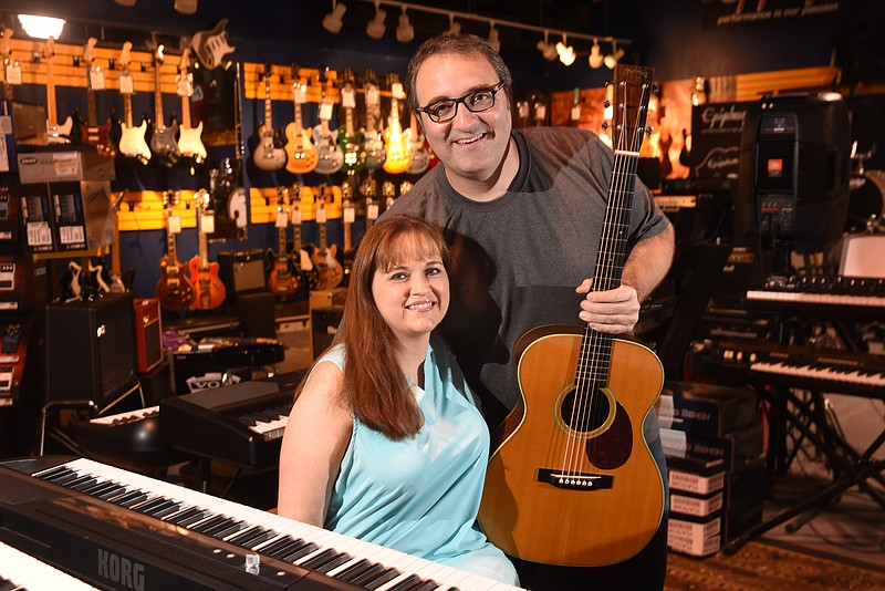 Brad and Jacqui Putt have been married nearly 20 years. Their business is Main Stage Music in downtown Dayton, Tenn.