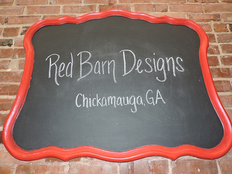 Red Barn Designs is all about giving new life to old things, like this antique mirror which was repurposed into a chalkboard for the store.