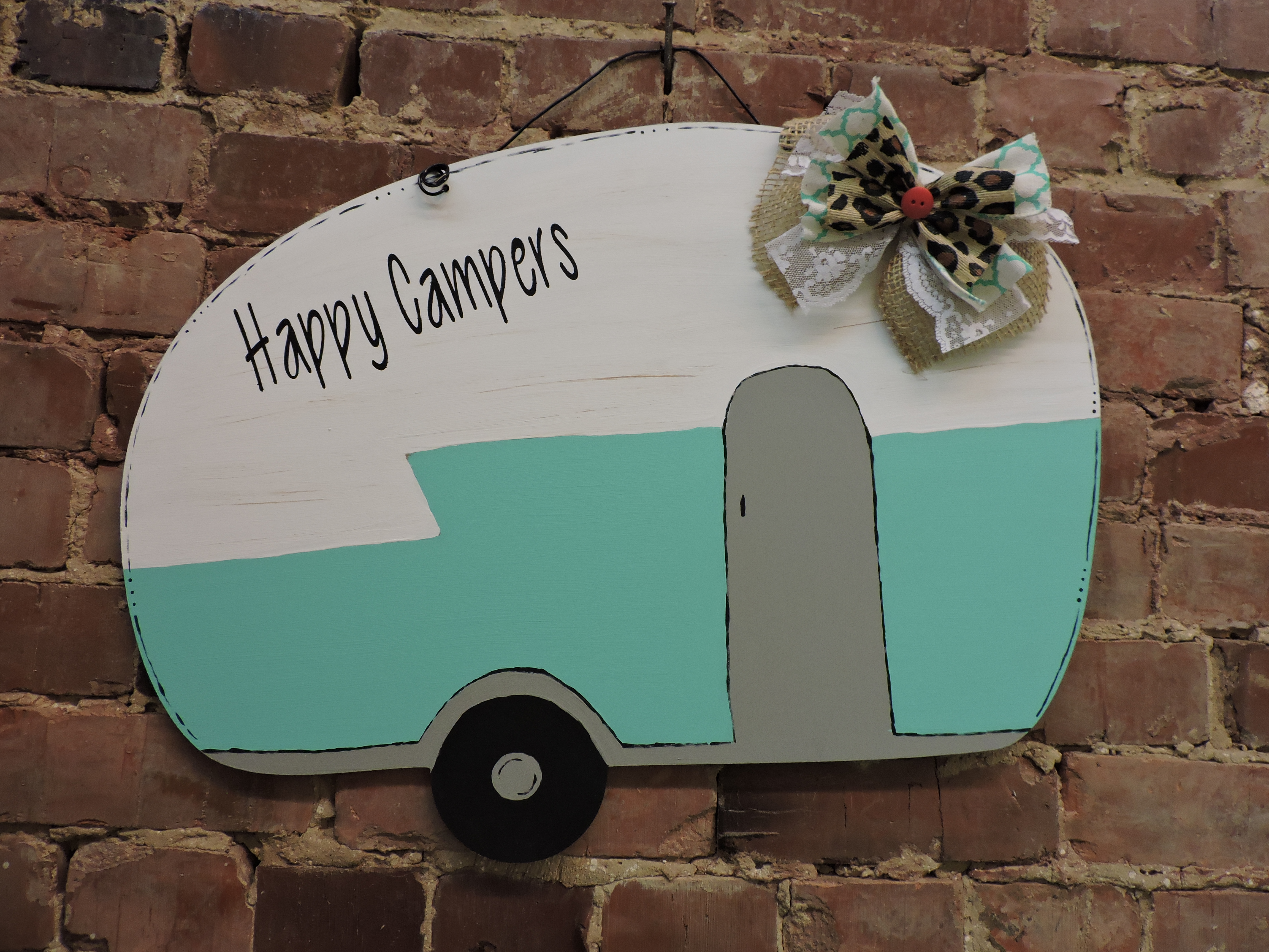 This "Happy Campers" doorknob hanger is one of many designs that ladies can paint at Red Barn Designs in Chickamauga during painting parties.