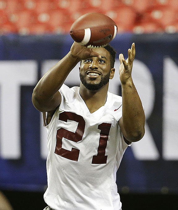 Alabama's Maurice Smith catches a pass during a team workout ahead of Saturday's Southeastern Conference championship NCAA college football game against Florida, Friday, Dec. 4, 2015, in Atlanta. (AP Photo/David Goldman)