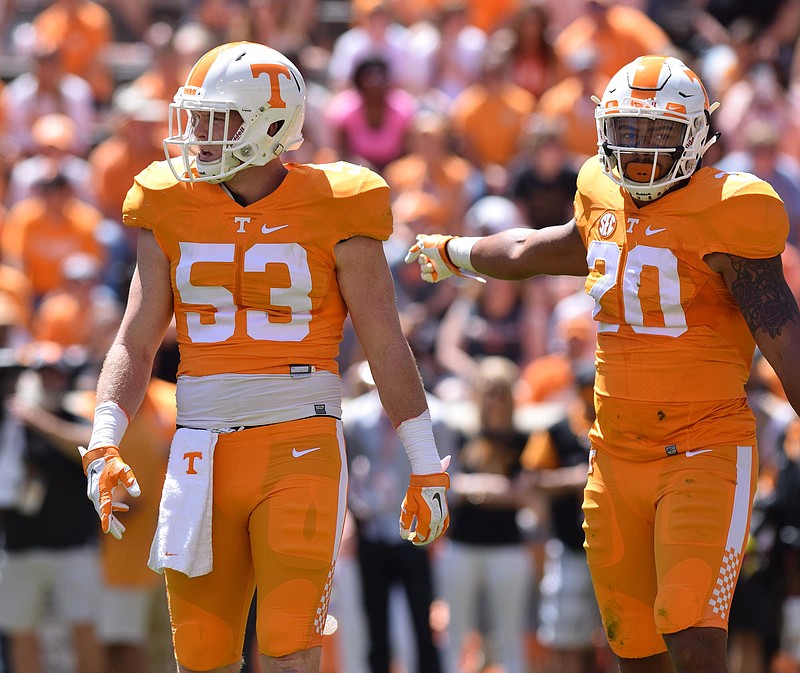 Colton Jumper (53) from Baylor School and Cortez McDowell (20) get ready to play defense in Tennessee's Orange/White spring football game last April 16 at Neyland Stadium in Knoxville.