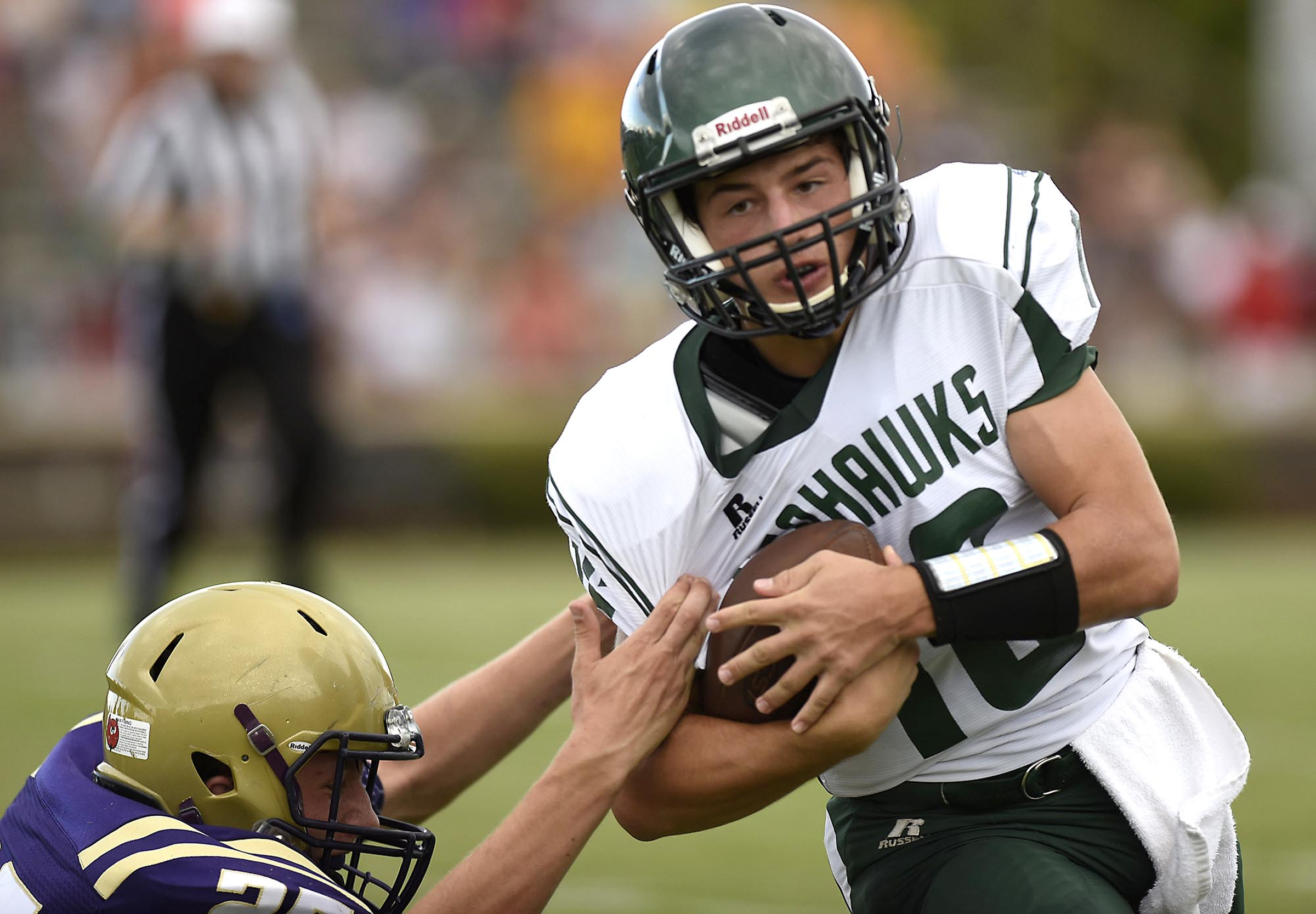 Silverdale's Alex Gonzalez (16) protects the ball from a Grundy defender. The Sequatchie Valley Football Jamboree was held at South Pittsburg High School on Friday August, 12, 2016.
