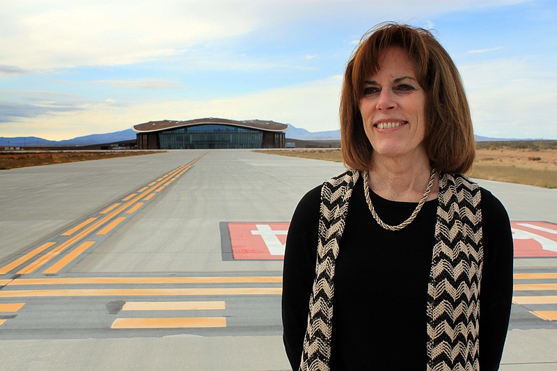 
              FILE - In this Dec. 9, 2014, file photo, Christine Anderson, executive director of the New Mexico Spaceport Authority, poses for a photo at the end of the taxiway at Spaceport America in Upham, N.M. Anderson is resigning, saying she still believes in the commercial space industry and that Spaceport America has a role to play. Anderson announced her resignation in a memo sent Tuesday, July 19, 2016, to the authority's board of directors and New Mexico Gov. Susana Martinez. (AP Photo/Susan Montoya Bryan, File)
            