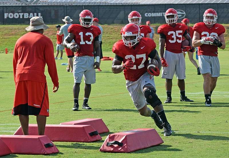 Georgia junior tailback Nick Chubb, shown practicing earlier this month, was tackled multiple times during Saturday's first preseason scrimmage.