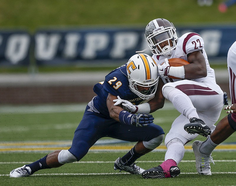 UTC defensive back Lucas Webb (29) tackles Fordham running back Chase Edmonds in the first half of the Mocs' FCS playoff football game against Fordham at Finley Stadium on Saturday, Nov. 28, 2015, in Chattanooga, Tenn.