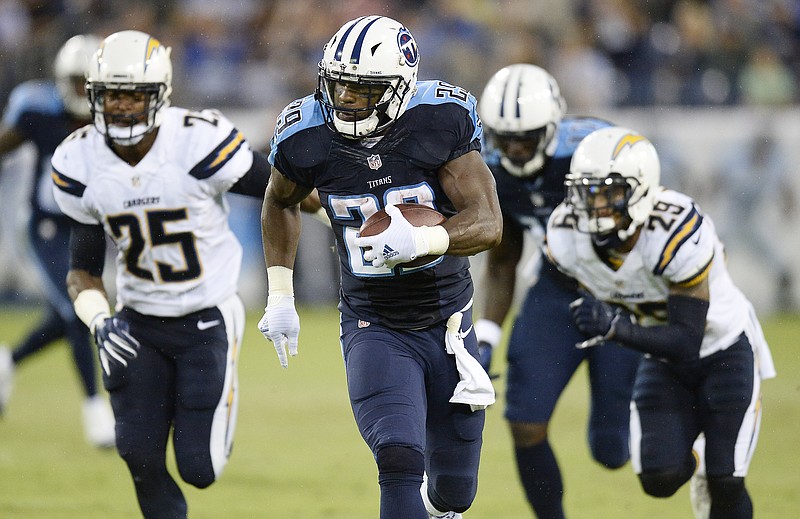 Tennessee Titans running back DeMarco Murray (29) runs past San Diego Chargers defensive back Darrell Stuckey (25) and San Diego Chargers cornerback Craig Mager (29) during the first half of an NFL preseason football game, Saturday, Aug. 13, 2016, in Nashville, Tenn. Murray ran 71-yards for a touchdown.