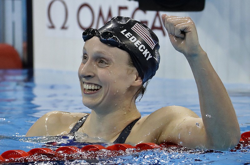 Unites States' Katie Ledecky celebrates after winning gold in the women's 800-meter freestyle final during the swimming competitions at the 2016 Summer Olympics, Friday, Aug. 12, 2016, in Rio de Janeiro, Brazil.