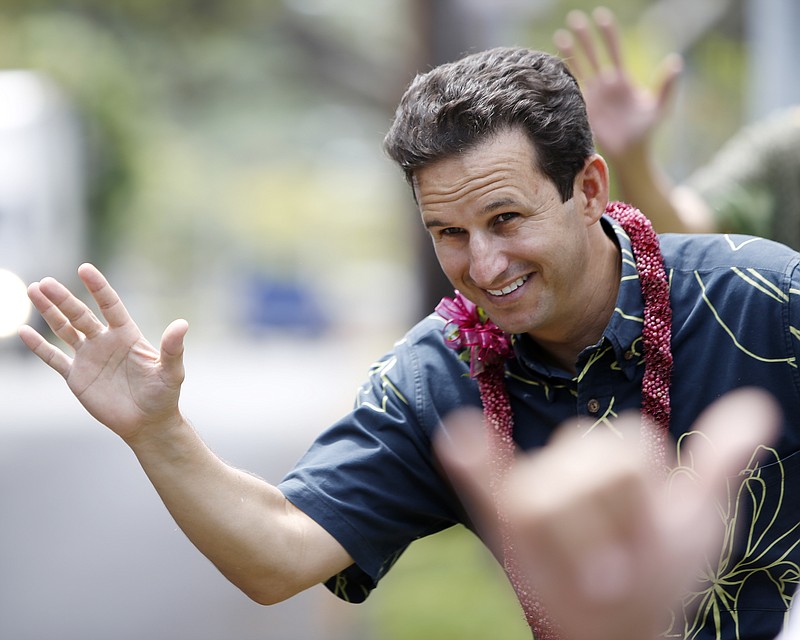 
              US Senator Brian Schatz waves to drivers as he campaigns for reelection, Saturday, Aug. 13, 2016, in Honolulu.  The incumbent Senator seeks his first full term as he was appointed to replace the late Sen. Daniel Inouye in 2012 and won a special election in 2014 to serve out the remainder of the term.  (AP Photo/Marco Garcia)
            