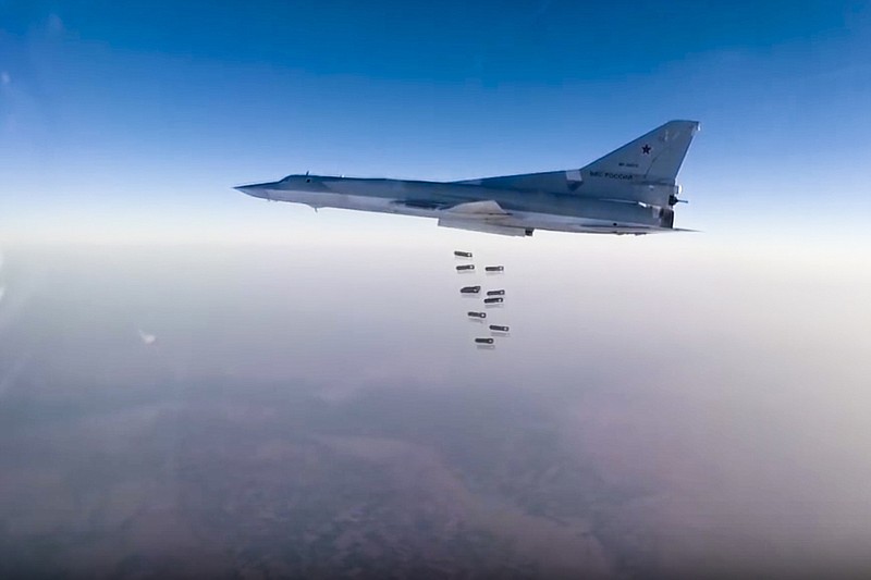 
              In this frame grab from video provided by the Russian Defence Ministry Press Service, Russian long range bomber Tu-22M3 flies during a strike above an undisclosed location in Syria on Sunday, Aug. 14, 2015. ( Russian Defence Ministry press service photo via AP)
            