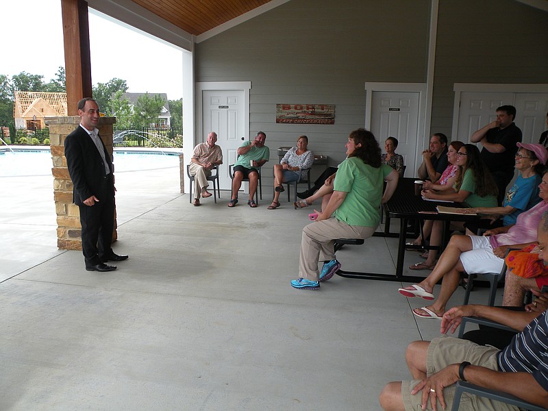 District 3 Chattanooga City Councilman Ken Smith, left, speaks to residents of the River Rock Cove community, who largely opposed a proposed nearby apartment project.