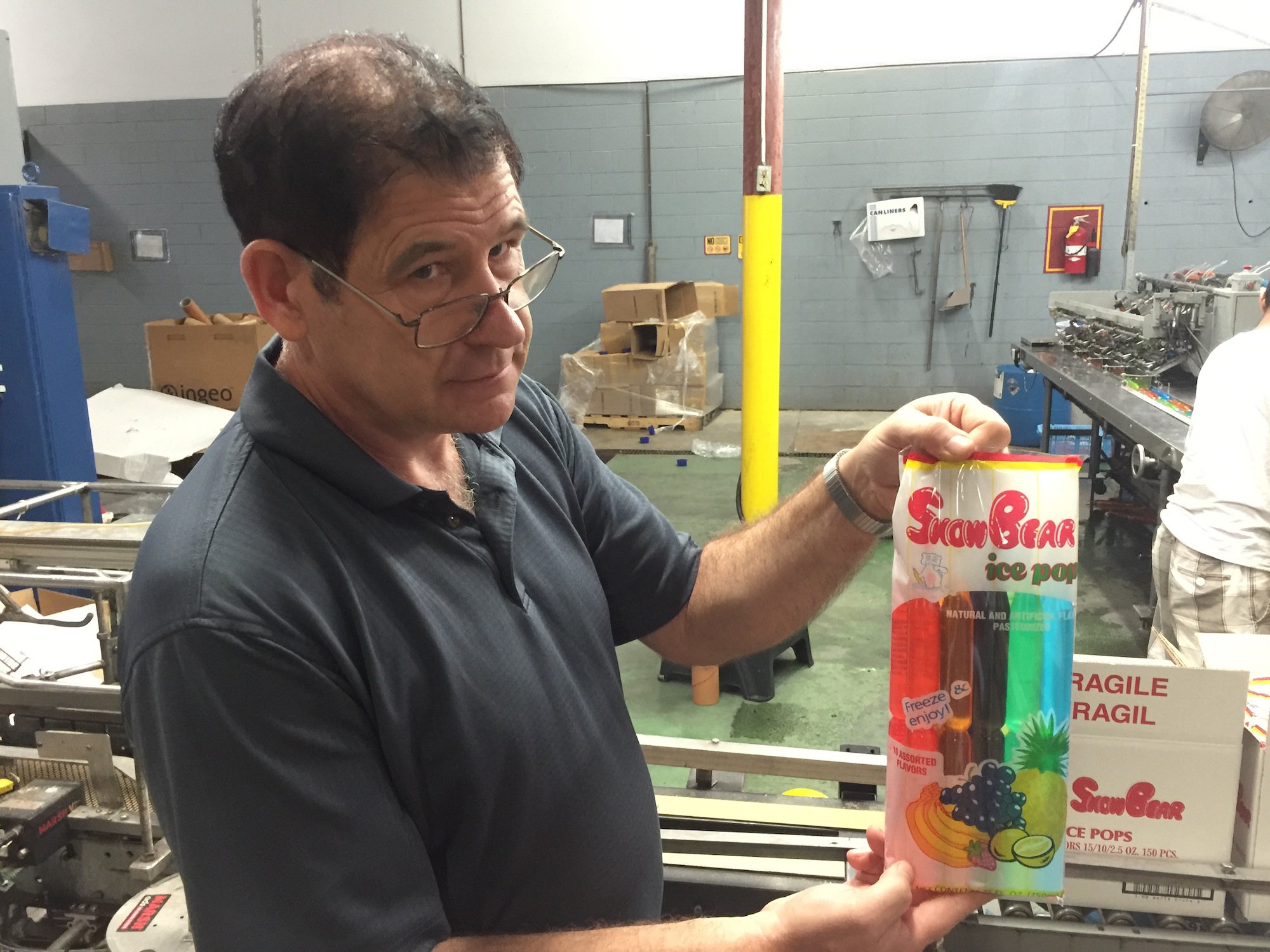 John Allman, general manager for Fun Treats Inc., in Cleveland, displays one of the ice pops the company makes and distributes. The company began in 1989 and expanded into its current 76,000-square-foot plant in 1994.