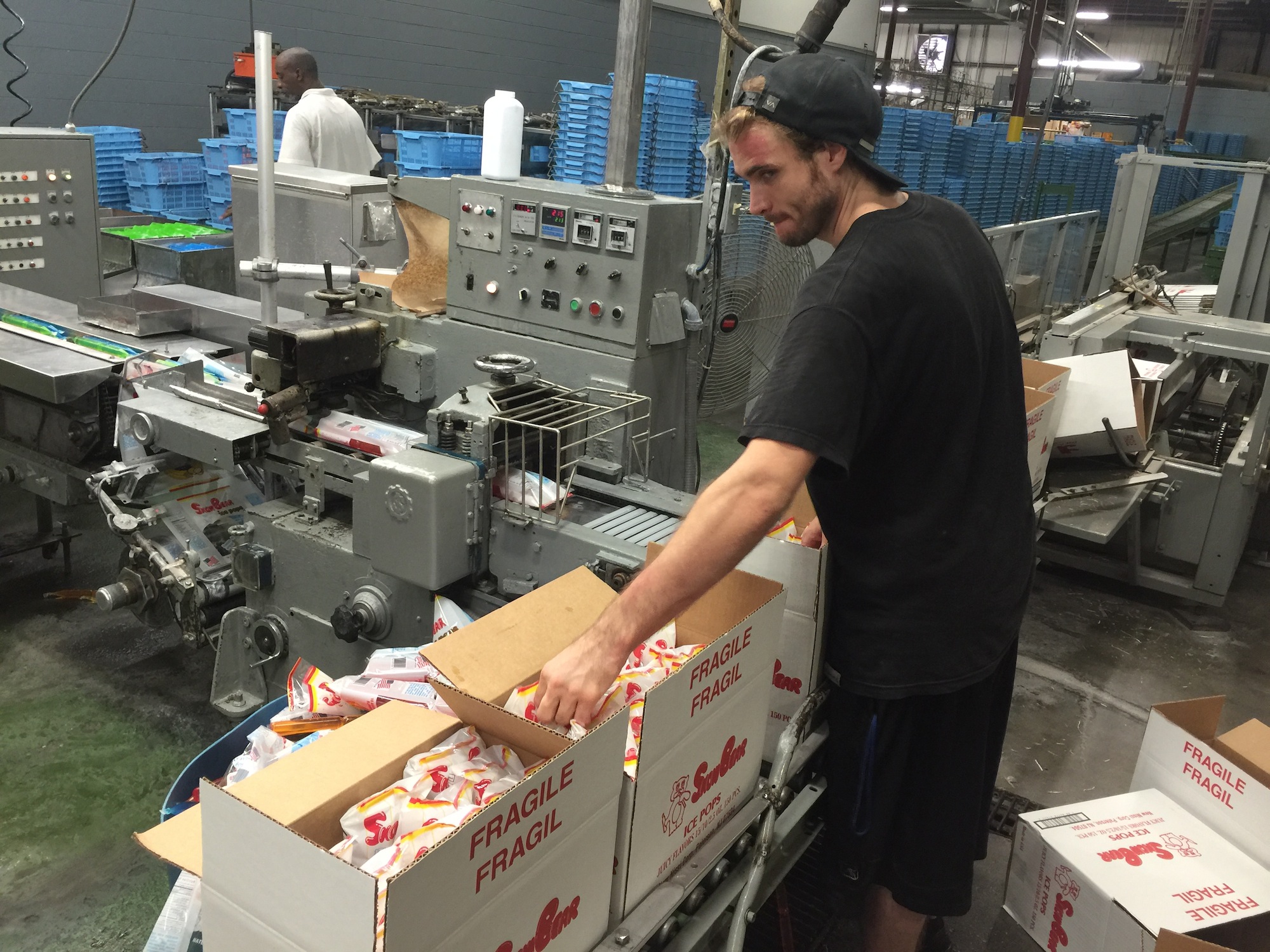 Ryan Haertl, a packer at Fun Treats, packs Snow Bear ice pops at the company's Cleveland, Tenn., plant.