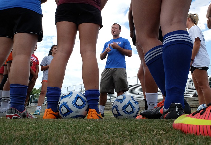 New Cleveland soccer coach Miles Christian directs practice Monday at the Cleveland soccer complex.