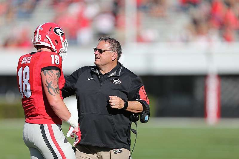 Georgia first-year offensive line coach Sam Pittman talks to five-star freshman tight end Isaac Nauta during the G-Day game in April.